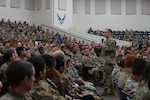 Col. Douglas C. Jeffrey IV, 433rd Airlift Wing commander, addresses Reserve Airmen during an all call on Joint Base San Antonio-Lackland, Texas, Oct. 5, 2025. The mission of the 433rd AW is to provide combat-ready Reserve Airmen, strategic airlift, and aeromedical evacuation capabilities in support of national defense objectives. (U.S. Air Force photo by Tech. Sgt. Adriana Barrientos)