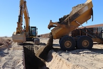 The U.S. Army Corps of Engineers contractors conduct trench stabilization construction in preparation for panel placement at the BMGR-1 border barrier project site near Yuma, Arizona, Oct. 28. USACE is replacing permanent border barriers along the southern border of the U.S. at the direction of the U.S. Army by the Secretary of War, in response to the presidential national emergency declaration dated Jan. 20, 2025, authorizing the use of Section 2803 of Title 10, U.S. Code.