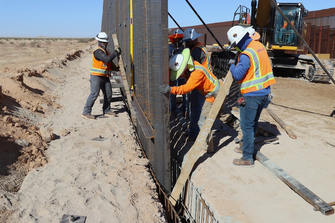 U.S. Army Corps of Engineers South Pacific Border Task Force install border barrier panels at the BMGR-1 project site near Yuma, Arizona, Oct. 29. USACE is replacing permanent border barriers along the southern border of the U.S. at the direction of the U.S. Army by the Secretary of War, in response to the presidential national emergency declaration dated Jan. 20, 2025, authorizing the use of Section 2803 of Title 10, U.S. Code