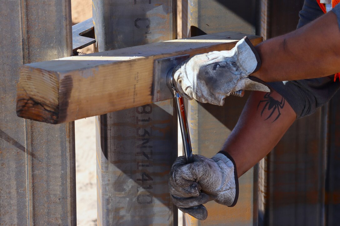 U.S. Army Corps of Engineers South Pacific Border Task Force install border barrier panels at the BMGR-1 project site near Yuma, Arizona, Oct. 29. USACE is replacing permanent border barriers along the southern border of the U.S. at the direction of the U.S. Army by the Secretary of War, in response to the presidential national emergency declaration dated Jan. 20, 2025, authorizing the use of Section 2803 of Title 10, U.S. Code