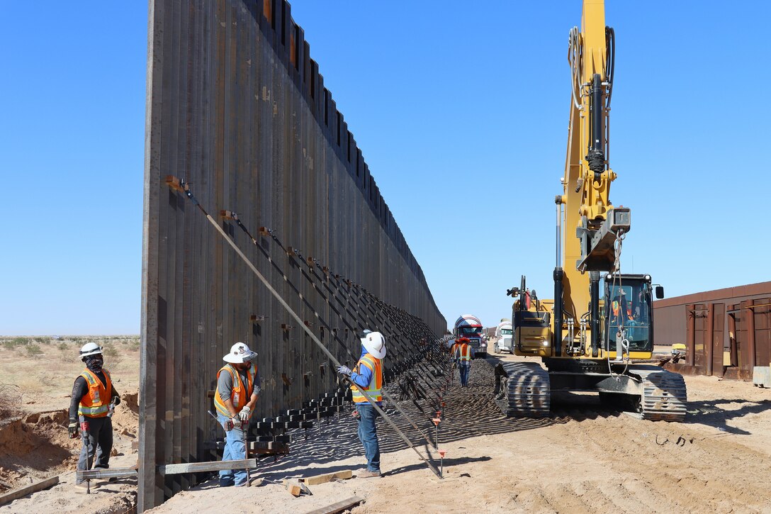 U.S. Army Corps of Engineers South Pacific Border Task Force install border barrier panels at the BMGR-1 project site near Yuma, Arizona, Oct. 29. USACE is replacing permanent border barriers along the southern border of the U.S. at the direction of the U.S. Army by the Secretary of War, in response to the presidential national emergency declaration dated Jan. 20, 2025, authorizing the use of Section 2803 of Title 10, U.S. Code