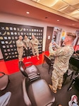 Army 1st Sgt. Randy Ward, Los Angeles MEPS senior enlisted advisor and Army Ly. Col. Matthew Paquin, Los Angeles MEPS commander, join an applicant for a photo at their new selfie station. Applicants at Los Angeles MEPS are celebrating their first step into military service at a new patriotic selfie station that connects them to a nationwide community of service members.