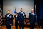 Col. Jeremy A. Patrick, left, 433rd Mission Support Group commander, Lt. Col. Brian E. Hoffman, center, 433rd Force Support Squadron outgoing commander and Lt. Col. Clayton S. Lawrence, right, 433rd FSS incoming commander, stand at attention during a change of command ceremony, Nov. 7, 2025, at Joint Base San Antonio-Lackland, Texas. The ceremony marked the official transition of command, honoring the service and leadership of Hoffman and welcoming Lawrence as the new commander of the 433rd FSS. (U.S. Air Force photo by Senior Airman Joshua Fontenot)