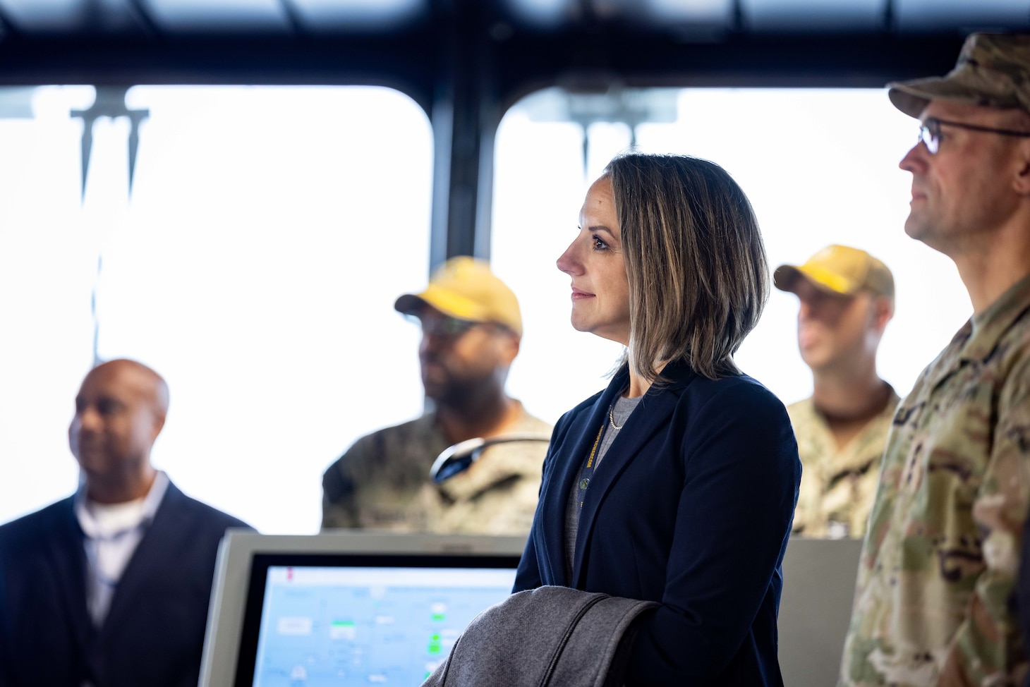 Laurie Beth Sargent, Human Resources Officer, Military Sealift Command (MSC), listens to remarks during Military Sealift Command’s assumption of command ceremony held on board USNS Robert F. Kennedy  (T-AO 208) Nov. 13, 2025. The ceremony is a time-honored tradition that marked the moment a new commander formally takes charge of a unit in the absence of an outgoing commander.