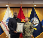 Dr. Johnny D. Jones, Chicago MEPS Education Services Specialist, poses with LTC Loren Petersen holding a proclamation from Illinois Governor JB Pritzker. Illinois Governor JB Pritzker issued a proclamation recognizing Dr. Jones for his innovative efforts in advancing the Armed Services Vocational Aptitude Battery (ASVAB) Career Exploration Program (CEP) and piloting the School Staff Testing (SST) model across Illinois.