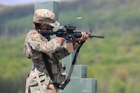 U.S. Army Spc. Dideoluwa Olu-Owotade, a logistics specialist with the 262nd Classification and Inspection Company, Delaware Army National Guard, fires an M4 carbine during an exercise at Fort Indiantown Gap, Pennsylvania, May 2, 2025. (U.S. Army National Guard photo by Spc. Annie M. Riley)