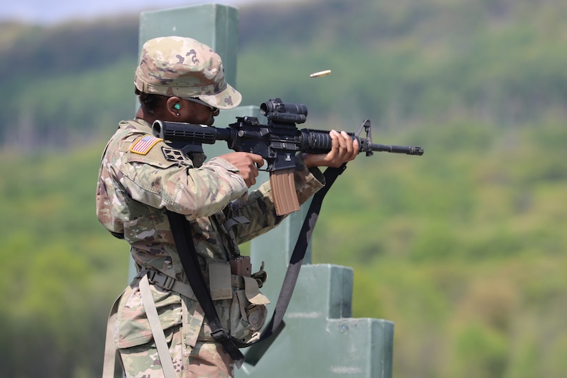 U.S. Army Spc. Dideoluwa Olu-Owotade, a logistics specialist with the 262nd Classification and Inspection Company, Delaware Army National Guard, fires an M4 carbine during an exercise at Fort Indiantown Gap, Pennsylvania, May 2, 2025. (U.S. Army National Guard photo by Spc. Annie M. Riley)