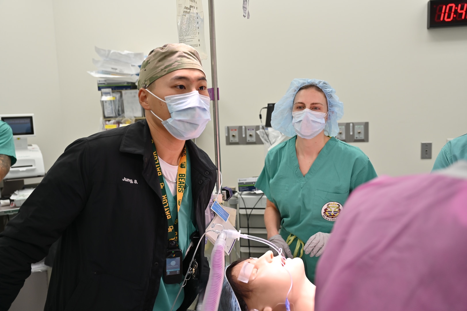 Capt. Jung leads the response during a malignant hyperthermia simulation at Carl R. Darnall Army Medical Center, directing medical personnel as they work through the scenario.