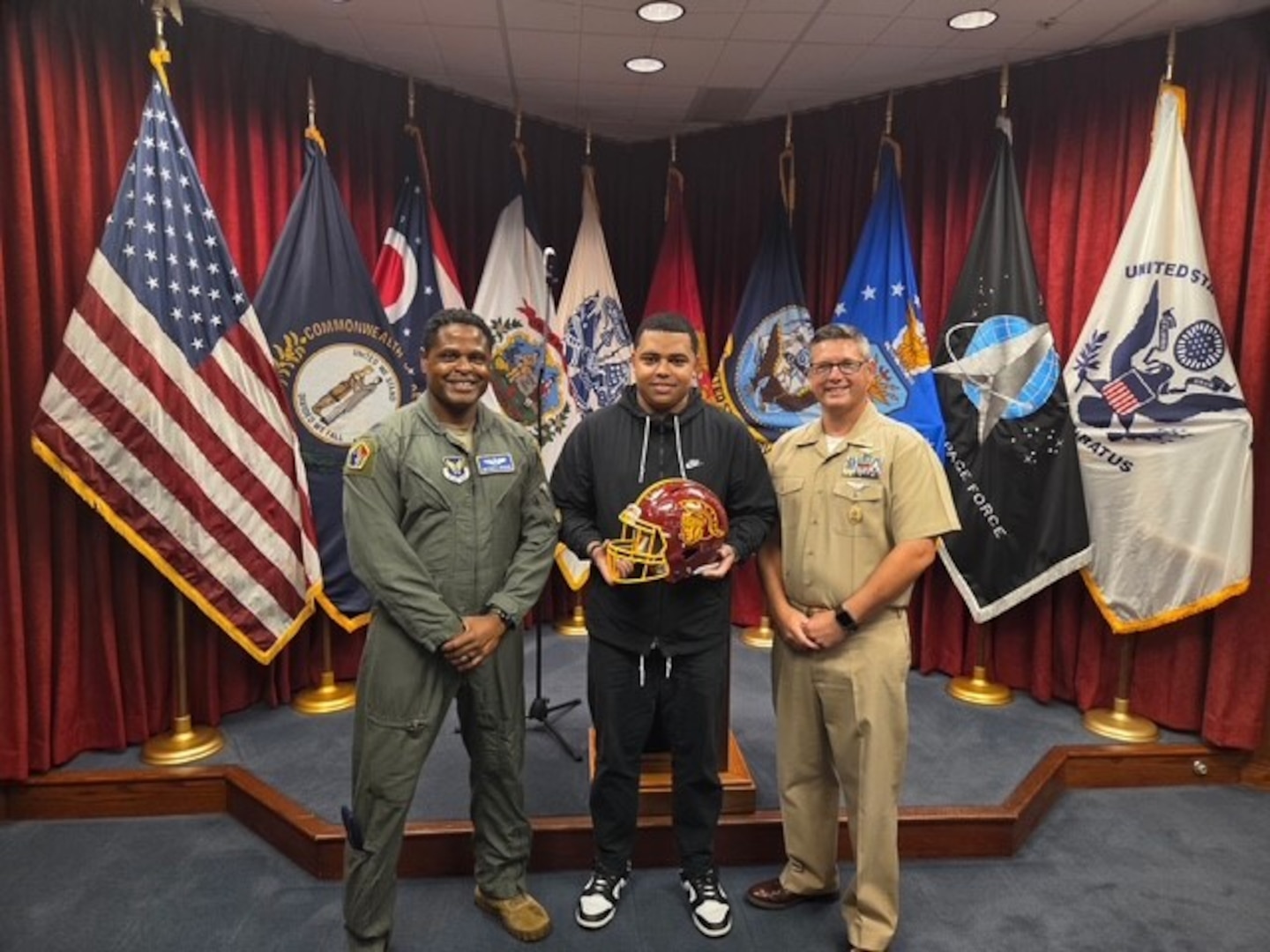 The Westerville North HS Varsity Football team poses with Marines after the Marine-style workout session.
