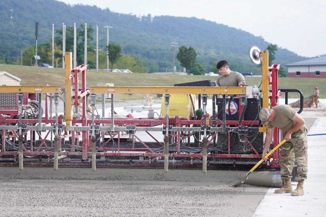 Airmen assigned to the 139th Civil Engineer Squadron, Missouri Air National Guard, construct a mock runway at Fort Indiantown Gap, Pennsylvania, Aug. 18, 2025. The site will be used for Rapid Airfield Damage Recovery training by civil engineers across the Air National Guard. (U.S. Air National Guard photo by Staff Sgt. Keenan Aitchison)