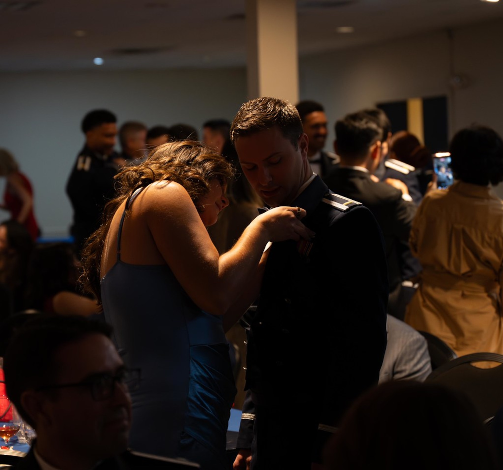 A student pilots and their guest dance together.