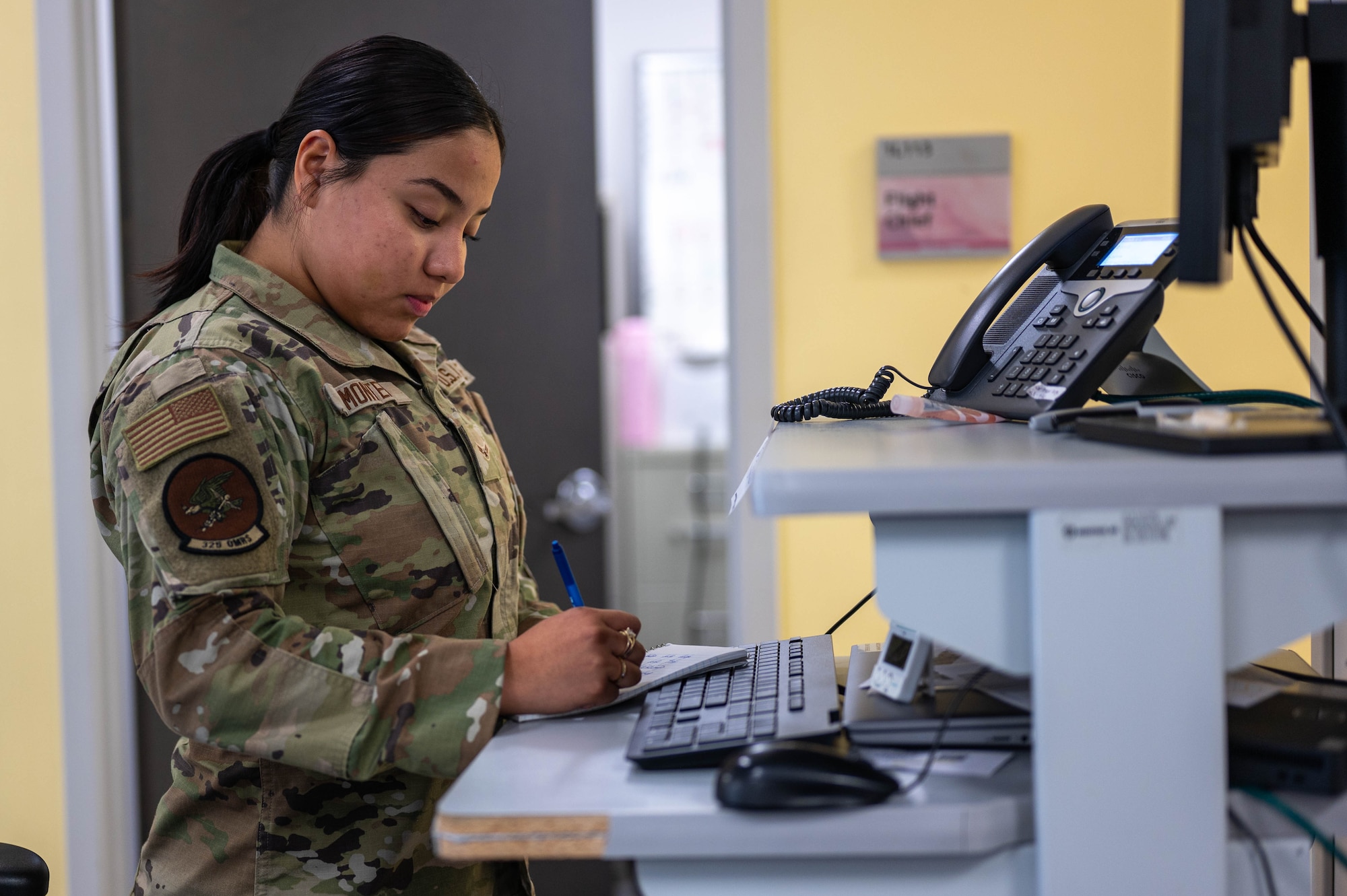 U.S. Air Force Airman 1st Class Jaritza Monter, 325th Operational Medical Readiness Squadron physical therapist technician, takes notes at Tyndall Air Force Base.