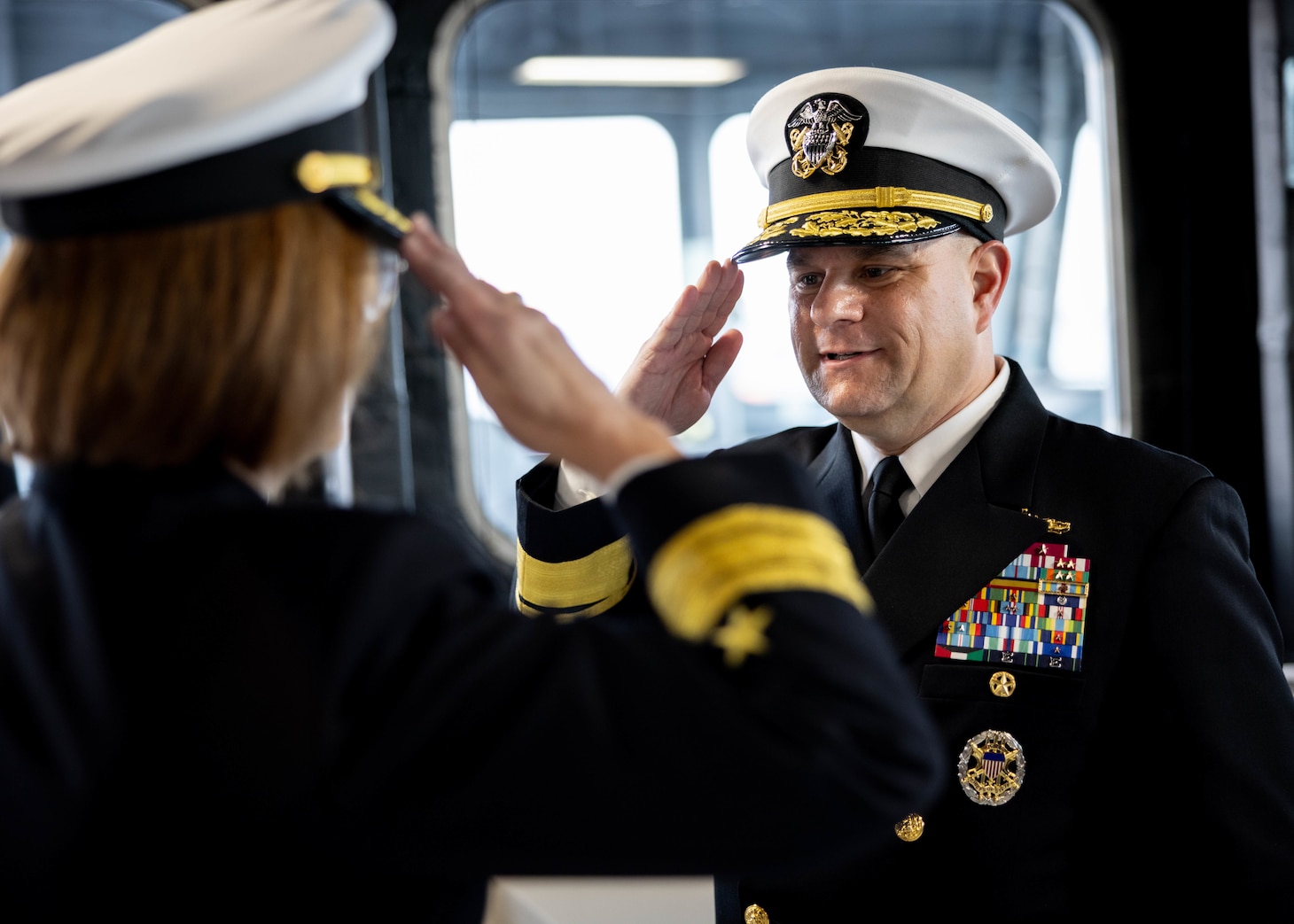 Rear Adm. Benjamin R. Nicholson, prospective Commander, Military Sealift Command (MSC), right, renders a salute to Vice Adm. John Gumbleton, acting Commander, U.S. Fleet Forces Command, and assumes the role of commanding officer during MSC’s assumption of command ceremony held on board USNS Robert F. Kennedy  (T-AO 208) Nov. 13, 2025. The ceremony is a time-honored tradition that marked the moment a new commander formally takes charge of a unit in the absence of an outgoing commander.