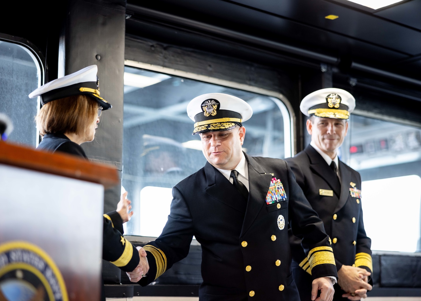 Rear Adm. Benjamin R. Nicholson, Commander, Military Sealift Command (MSC), is congratulated by Rear Adm. Kimberly A. Walz, Deputy Commander, MSC, after MSC’s assumption of command ceremony held on board USNS Robert F. Kennedy  (T-AO 208) Nov. 13, 2025. The ceremony is a time-honored tradition that marks the moment a new commander formally takes charge of a unit in the absence of an outgoing commander.