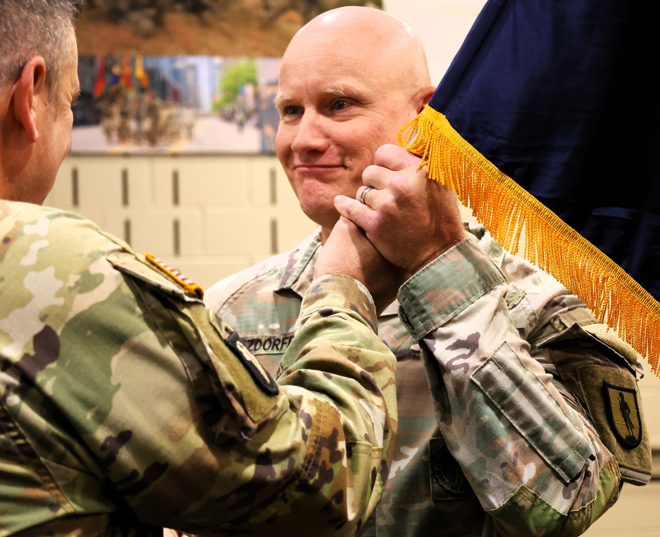 Col. Paul Metzdorff receives the 129th Regiment (Regional Training Institute) guidon from Brig. Gen. Lenny Williams.