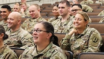 Noncommissioned officer in the Illinois Army National Guard's 129th Regiment (Regional Training Institute) listen to Col. Shawn Nokes.