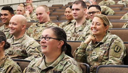 Noncommissioned officer in the Illinois Army National Guard's 129th Regiment (Regional Training Institute) listen to Col. Shawn Nokes.