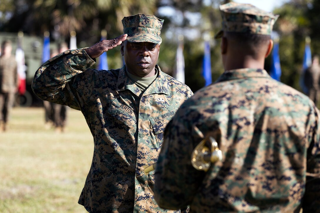 U.S. Marine Corps Sgt. Maj. Shonor Burton reports to Col. David Merles, commanding officer of Blount Island Command, to receive the sword of office during the Nov. 14 relief and appointment ceremony at Marine Corps Support Facility Blount Island, Florida. The sword was passed from Sgt. Maj. Julian Lumm, marking the transfer of senior enlisted leadership after Lumm’s 30 years of service. (Official Marine Corps Photo by Dustin Senger)