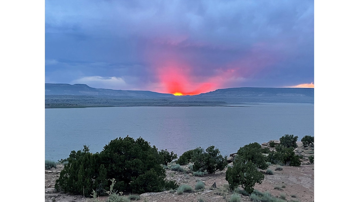 This sunset looks exactly like a ZIA sun symbol tilted slightly on its side. The photo was taken July 14, 2024, at the Abiquiu Lake Cerrito Recreation Area, by Pamela Bowie, Abiquiu Lake park ranger and USACE-South Pacific Division water safety representative.
