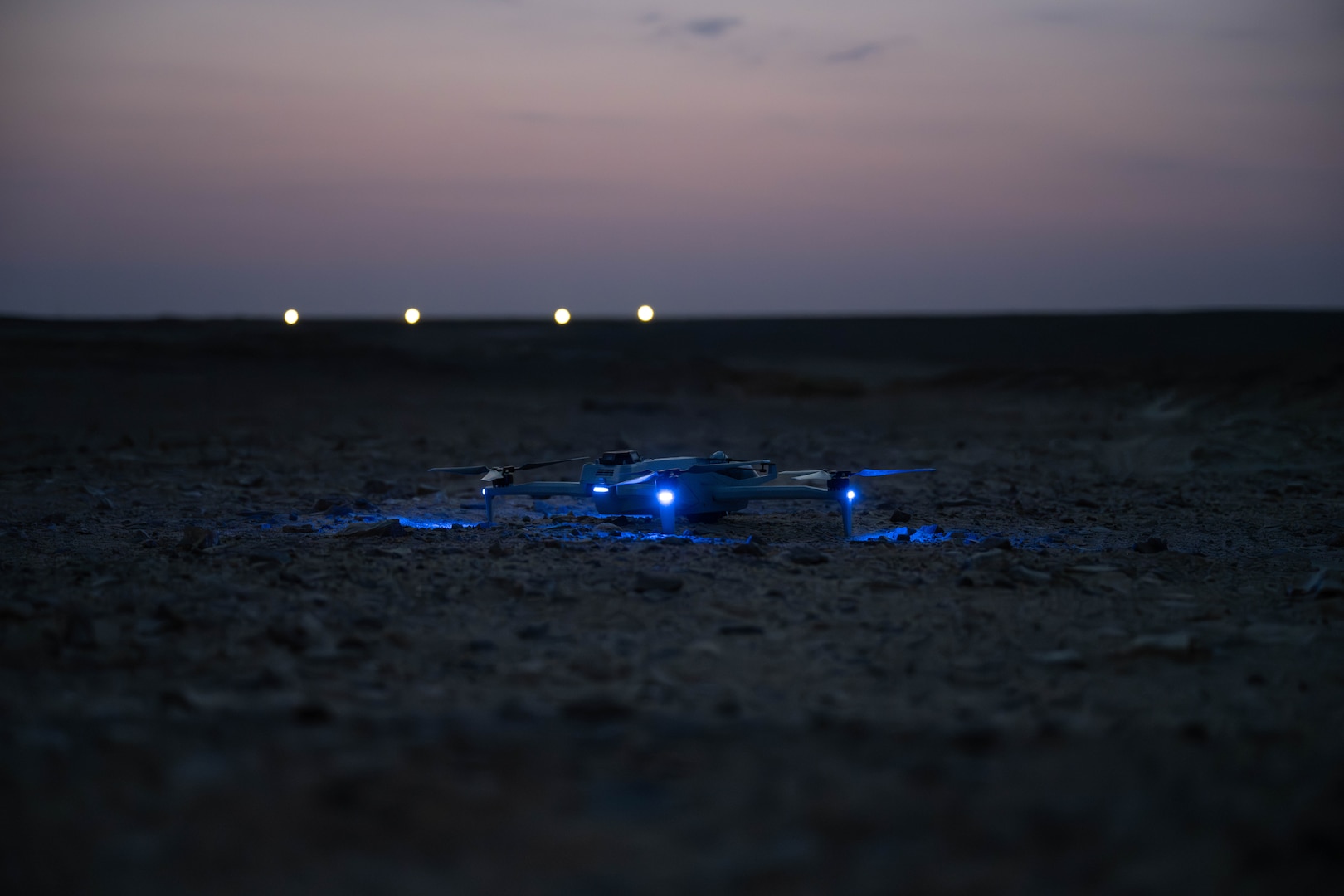 A Skydio quadcopter lights up during a pre-flight check in the U.S. Central Command area of responsibility Nov. 4,  2025. The quadcopter is equipped with multiple camera capabilities, including a 360-degree field of view, thermal imaging and advanced high-resolution zoom, giving defenders a detailed look at their surroundings to view threats. (U.S. Air Force photo by Senior Airman Kari Degraffenreed)