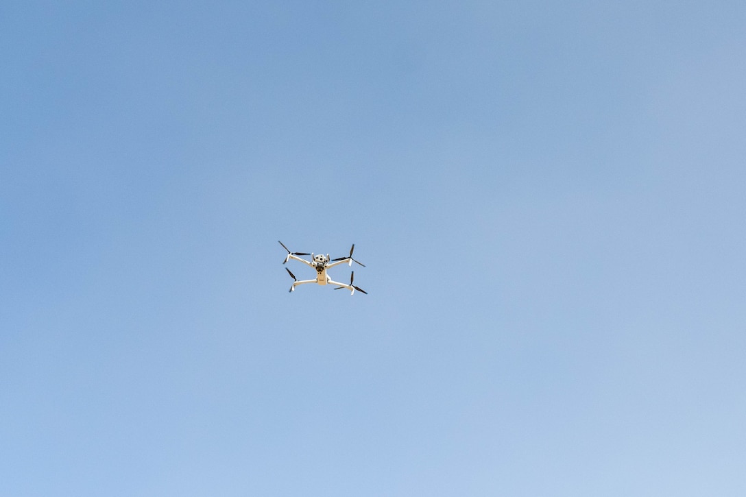 A Skydio quadcopter hovers in the U.S. Central Command area of responsibility Nov. 6, 2025. The quadcopter is equipped with multiple camera capabilities, including a 360-degree field of view, thermal imaging and advanced high-resolution zoom, giving defenders a detailed look at their surroundings. (U.S. Air Force photo by Senior Airman Kari Degraffenreed)
