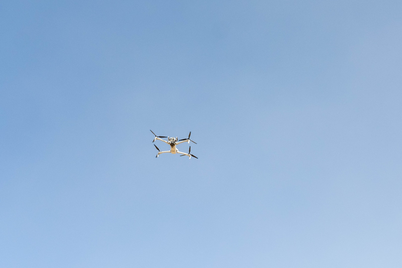 A Skydio quadcopter hovers in the U.S. Central Command area of responsibility Nov. 6, 2025. The quadcopter is equipped with multiple camera capabilities, including a 360-degree field of view, thermal imaging and advanced high-resolution zoom, giving defenders a detailed look at their surroundings. (U.S. Air Force photo by Senior Airman Kari Degraffenreed)