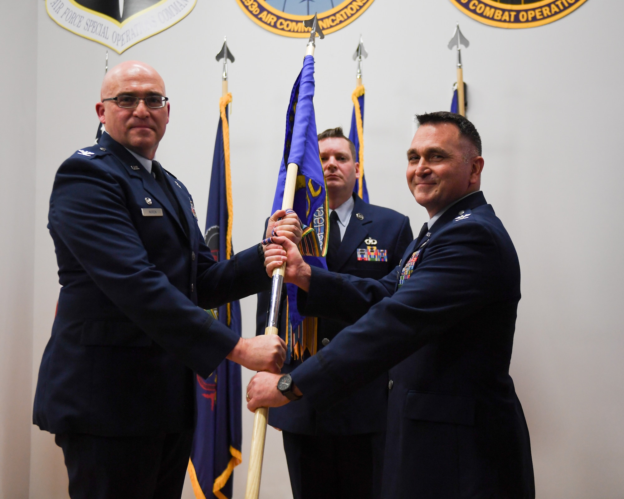 Col. Kevin Dellicker (right) assumed command of the 193rd Air Operations Group after receiving the guidon from Col. Robert Noren, commander of the 193rd Special Operations Wing, during a ceremony at the 193rd AOG in State College, Pennsylvania, on Nov. 15, 2025.