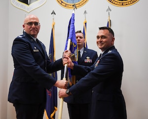 Col. Kevin Dellicker (right) assumed command of the 193rd Air Operations Group after receiving the guidon from Col. Robert Noren, commander of the 193rd Special Operations Wing, during a ceremony at the 193rd AOG in State College, Pennsylvania, on Nov. 15, 2025.
