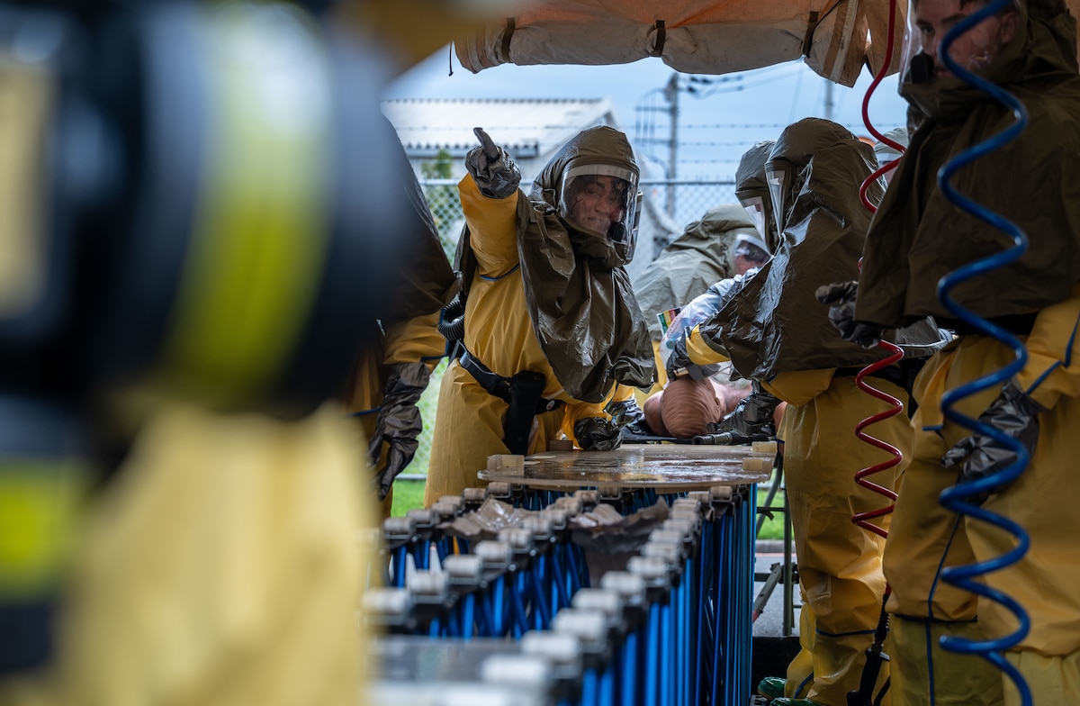 An Airman directs other Airmen.