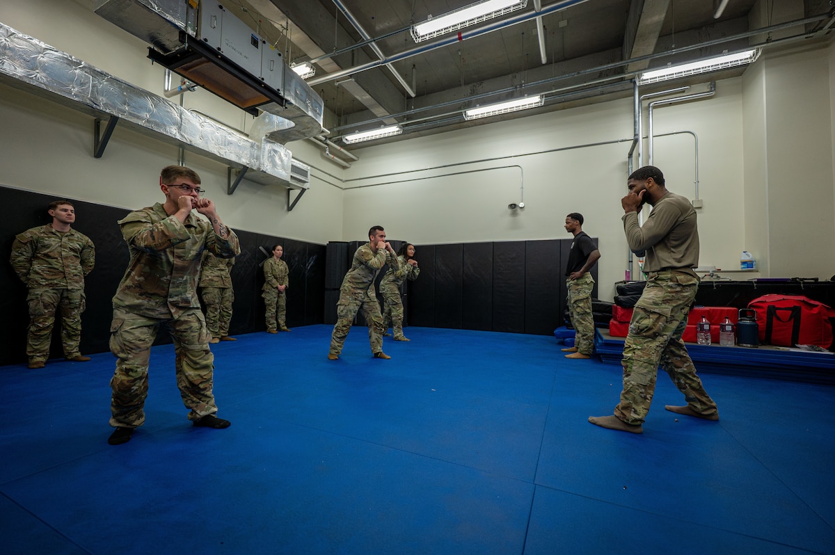 A pair of Airmen train for combat.