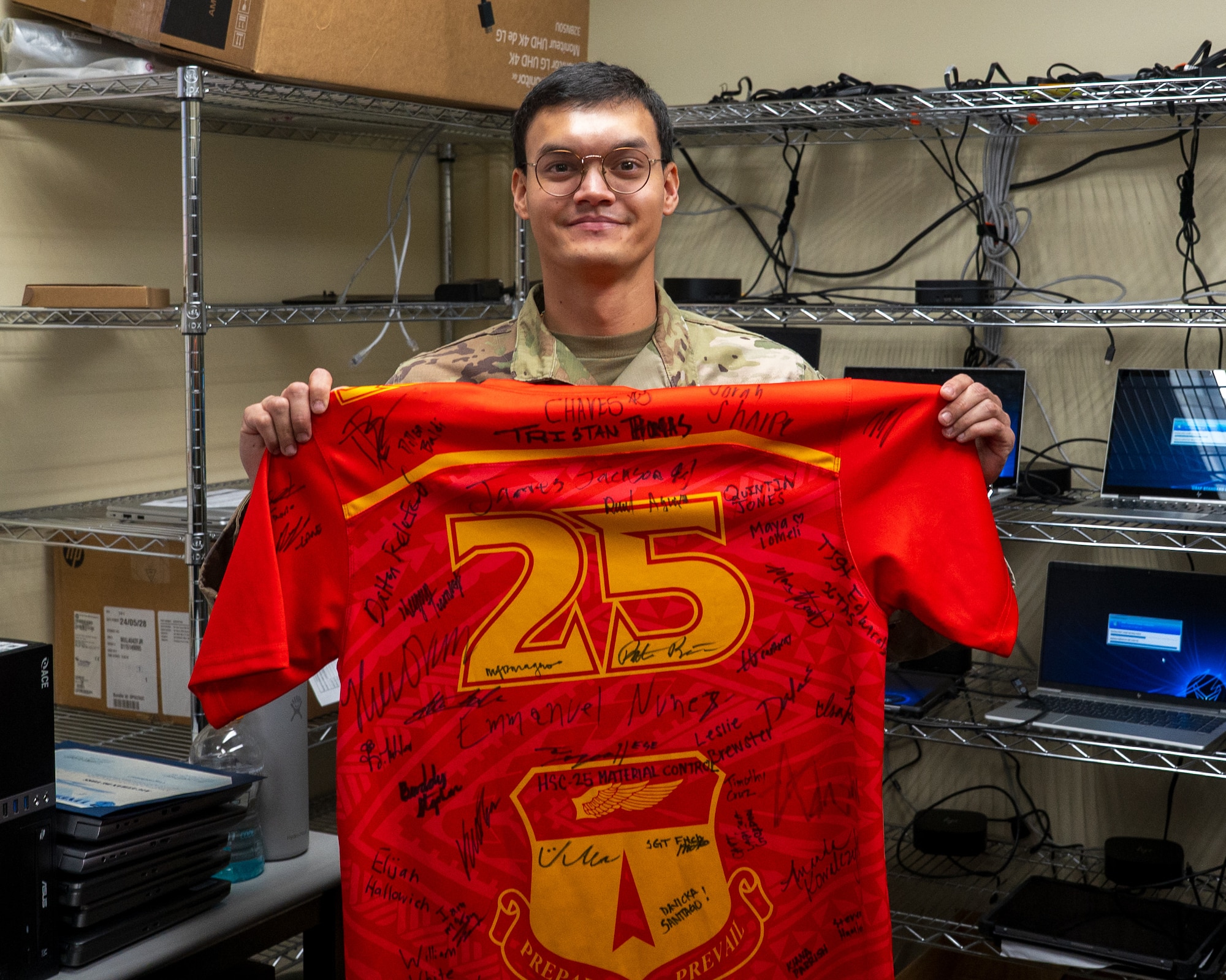 Airman 1st Class Ethan De Voss, a client systems technician for the 36th Communications Squadron, receives Linebacker of the Week recognition by the 36th Wing Command Team on Andersen Air Force Base, Guam, Oct. 29, 2025.