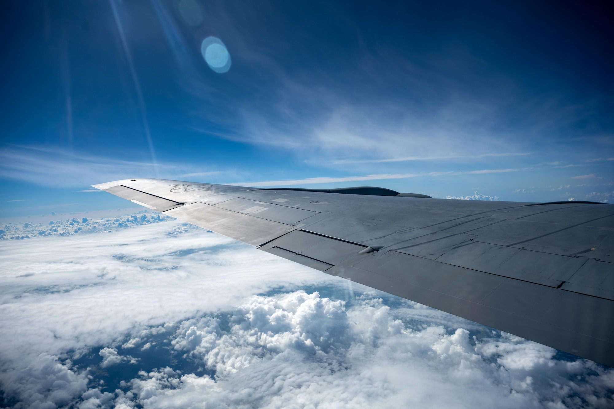 A U.S. Air Force KC-135 Stratotanker assigned to the 909th Air Refueling Squadron flies over the Pacific Ocean during a refueling mission in preparation of Exercise Bushido Guardian 2025.