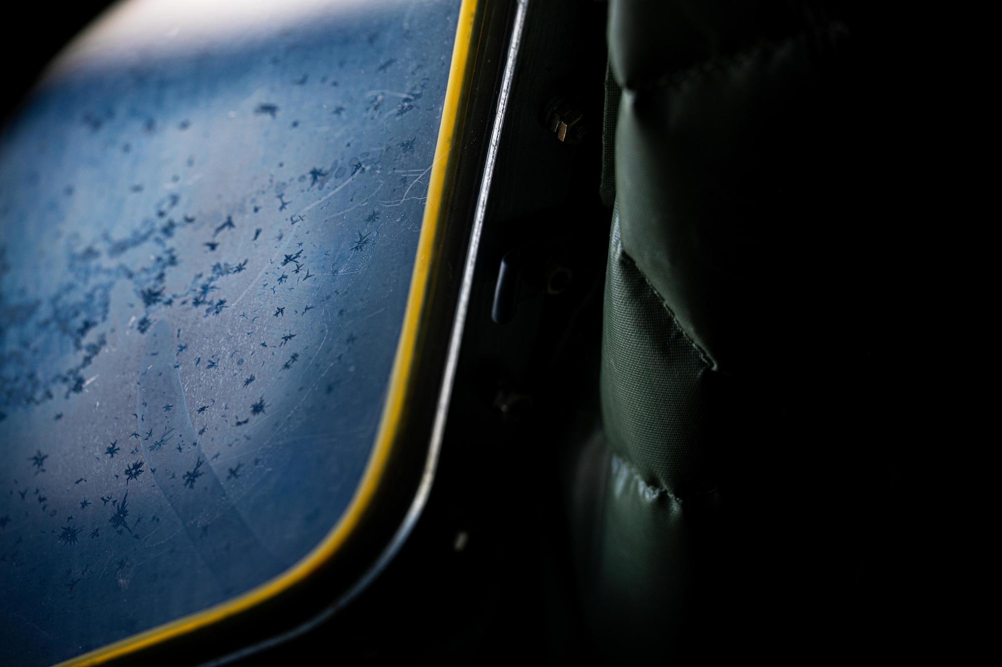 Frost collects on the window of a U.S. Air Force KC-135 Stratotanker assigned to the 909th Air Refueling Squadron during a refueling mission in preparation of Exercise Bushido Guardian 2025 over the Pacific Ocean.