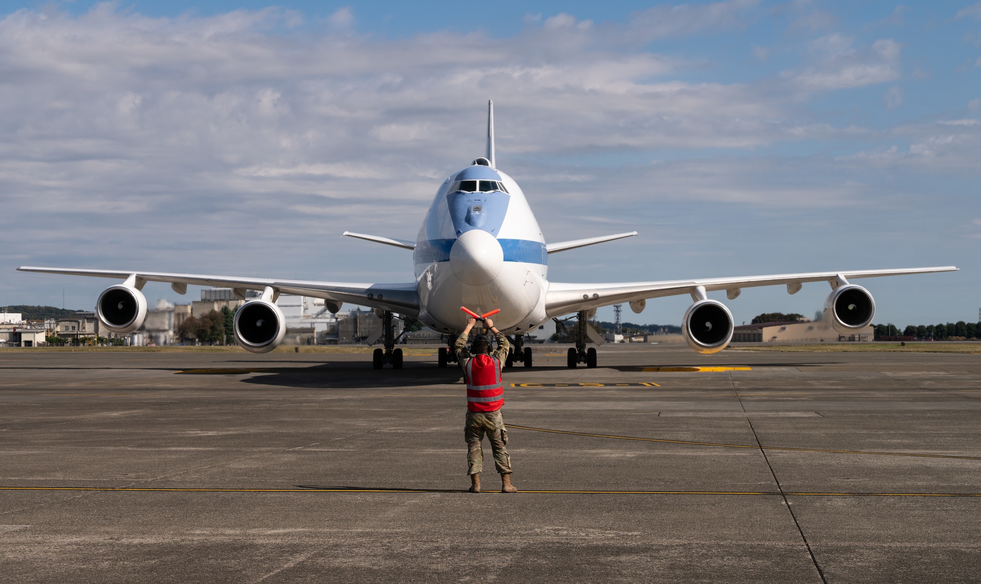 An Airman marshals an aircraft on the flightline.
