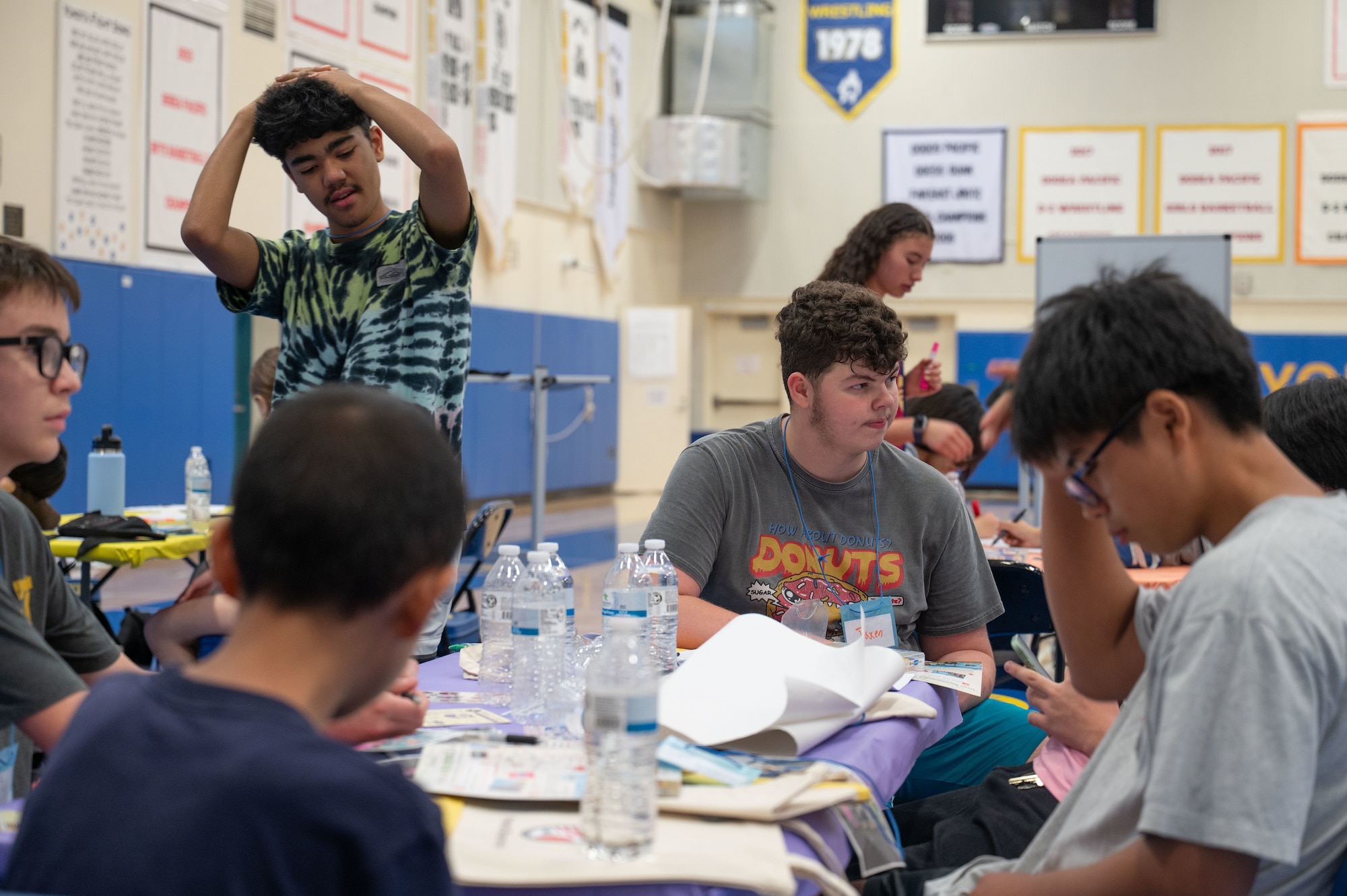 A group of students works together on their project.