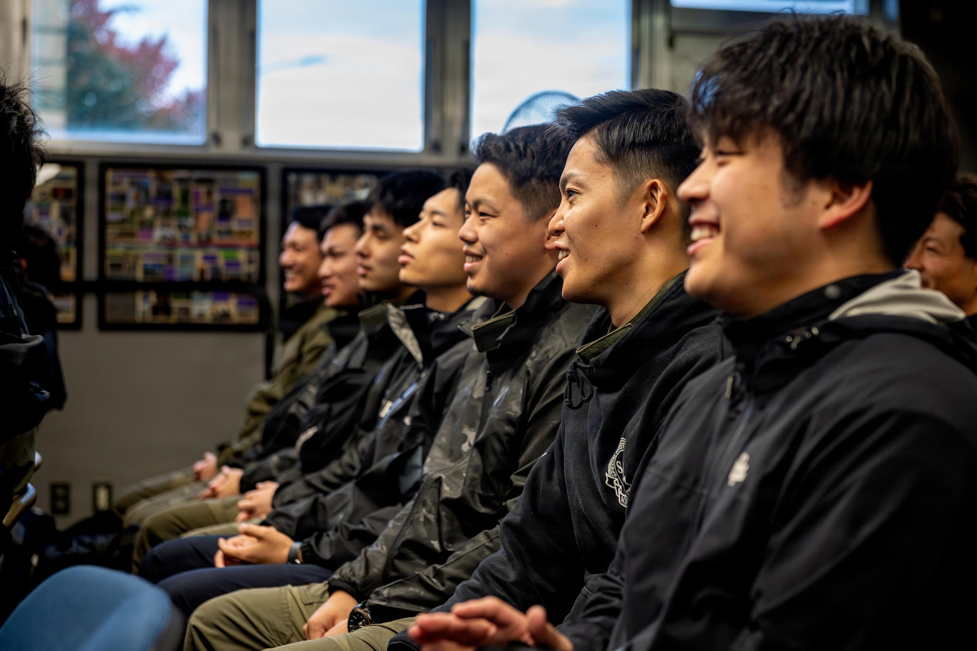 Japanese National Police Special Investigation Team members listen to introductions during a joint special weapons and tactics training event.