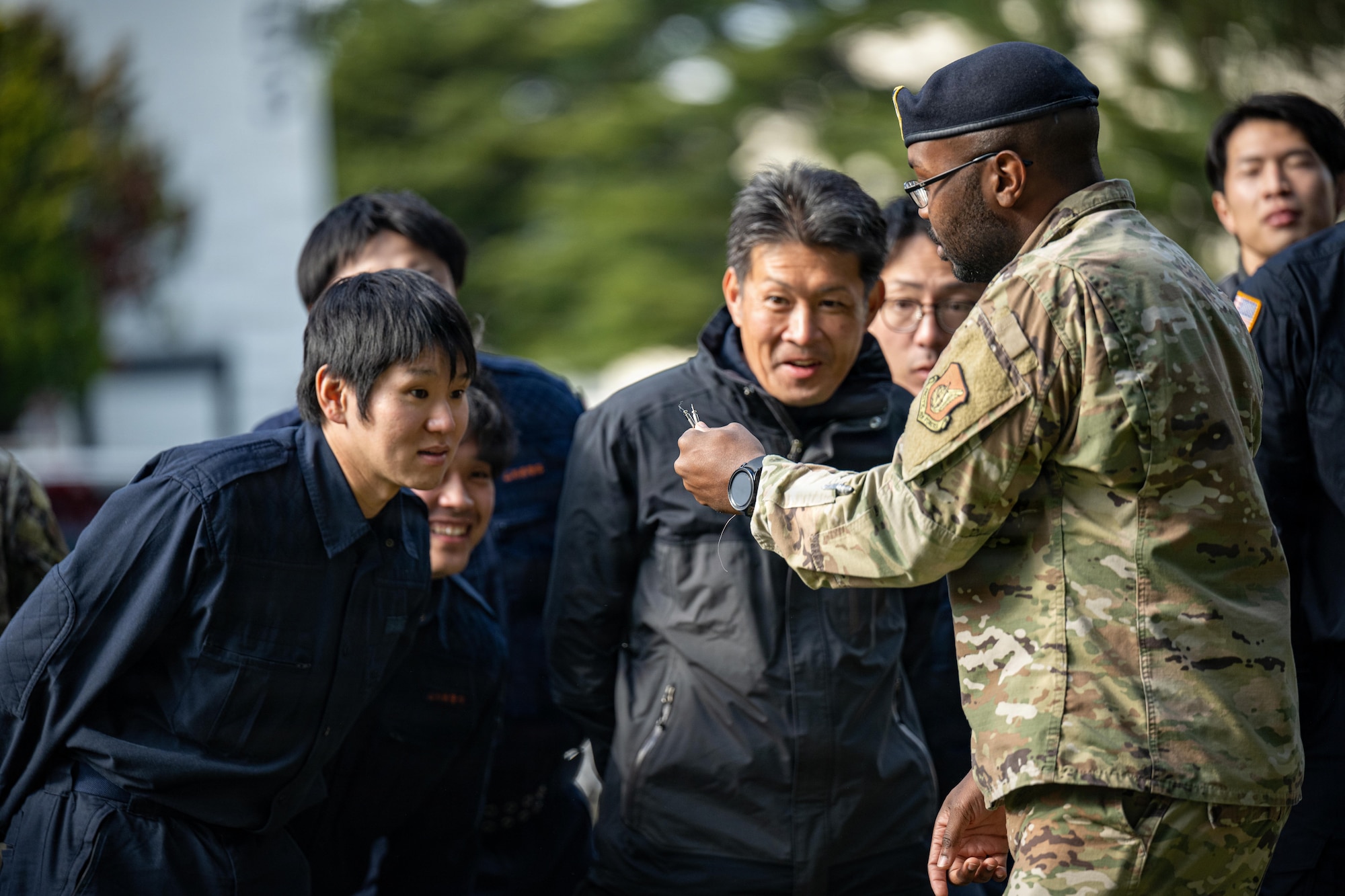 U.S. Air Force Staff Sgt. Wendall Banks, 35th Security Forces Squadron unit trainer and sponsor, showcases a taser probe to local Japanese police forces during a joint special weapons and tactics training event.
