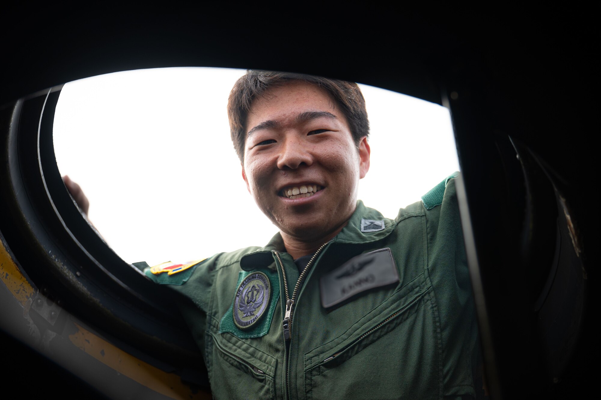Man sits in aircraft.