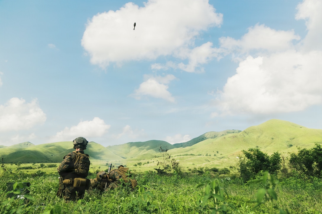 U.S. Marines with Lima Company, Battalion Landing Team 3/6, 22nd Marine Expeditionary Unit (Special Operations Capable), fire an M224 60 mm mortar system during a high explosives range on Camp Santiago, Puerto Rico, Nov. 2, 2025. U.S. military forces are deployed to the Caribbean in support of the U.S. Southern Command mission, Department of War-directed operations, and the president's priorities to disrupt illicit drug trafficking and protect the homeland. (U.S. Marine Corps photo)