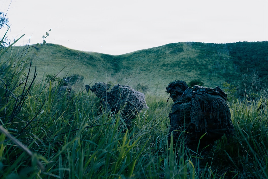U.S. Marines with Light Armored Reconnaissance Company, Battalion Landing Team 3/6, 22nd Marine Expeditionary Unit (Special Operations Capable), move toward an objective during a reconnaissance and surveillance exercise on Camp Santiago, Puerto Rico, Nov. 12, 2025. U.S. military forces are deployed to the Caribbean in support of the U.S. Southern Command mission, Department of War-directed operations, and the president's priorities to disrupt illicit drug trafficking and protect the homeland. (U.S. Marine Corps photo)