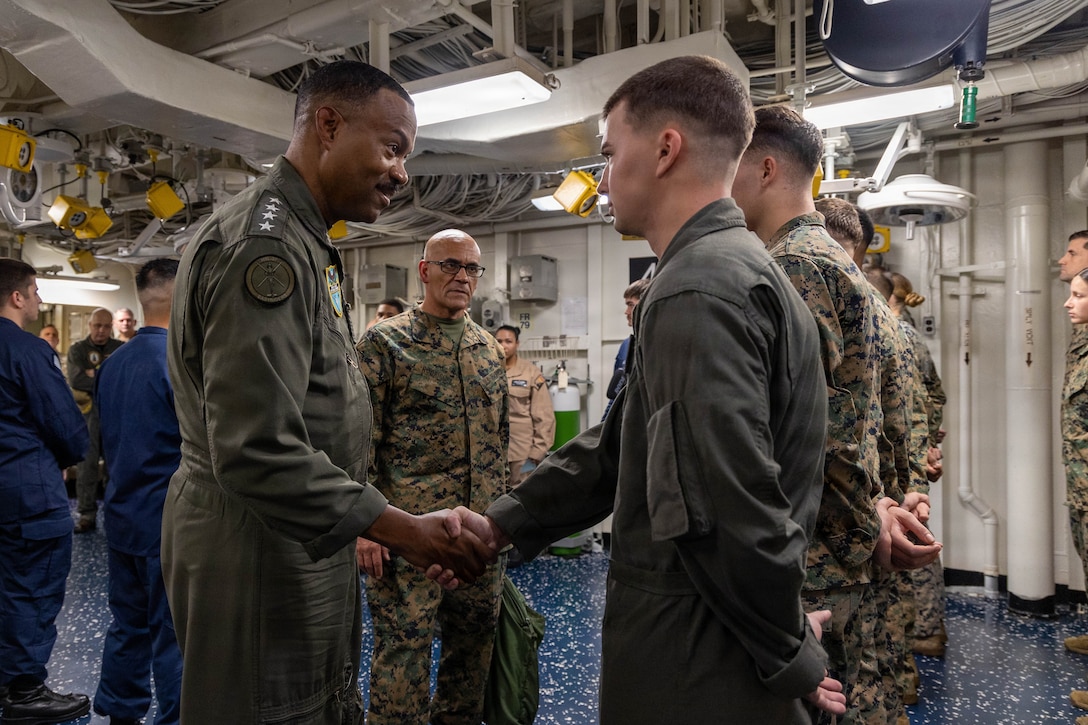 CARIBBEAN SEA – U.S. Navy Adm. Alvin Holsey, commander of U.S. Southern Command, recognizes a Marine with Battalion Landing Team 3/6, 22nd Marine Expeditionary Unit (Special Operations Capable), aboard Wasp-class amphibious assault ship USS Iwo Jima (LHD 7) while underway in the Caribbean Sea, Nov. 5, 2025. U.S. military forces are deployed to the Caribbean in support of the U.S. Southern Command mission, Department of War-directed operations, and the president’s priorities to disrupt illicit drug trafficking and protect the homeland. (U.S. Marine Corps photo)