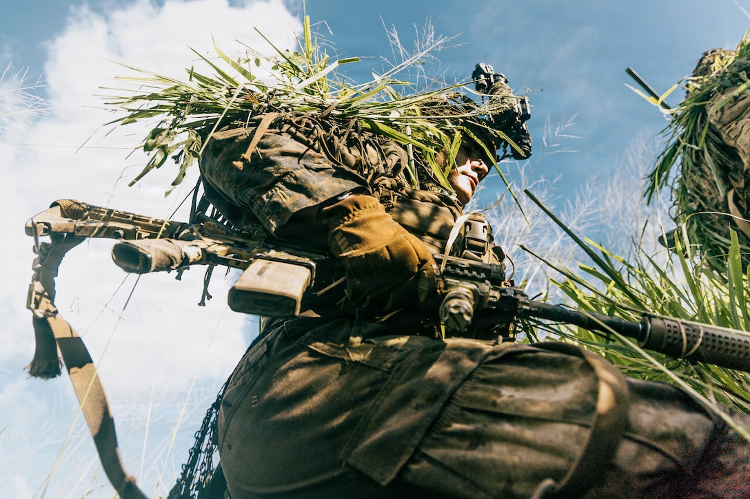 A U.S. Marine with Light Armored Reconnaissance Company, Battalion Landing Team 3/6, 22nd Marine Expeditionary Unit (Special Operations Capable), participates in a reconnaissance and surveillance exercise on Camp Santiago, Puerto Rico, Nov. 12, 2025.