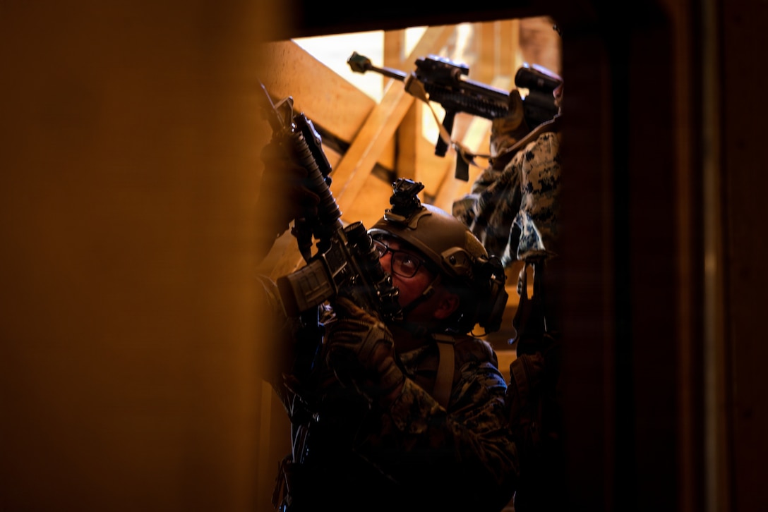 U.S. Marines with Kilo Company, Battalion Landing Team 3/5, 11th Marine Expeditionary Unit, clear the top floor of a building during military operations in urban terrain training as part of MEU Exercise 26.1 on Marine Corps Base Camp Pendleton, California, Nov. 4, 2025. During MEUEX, BLT 3/5 conducted company-level training, live-fire ranges and battle drills, employing various weapon systems to maintain mission readiness.  (U.S. Marine Corps photo by Sgt. Trent A. Henry)