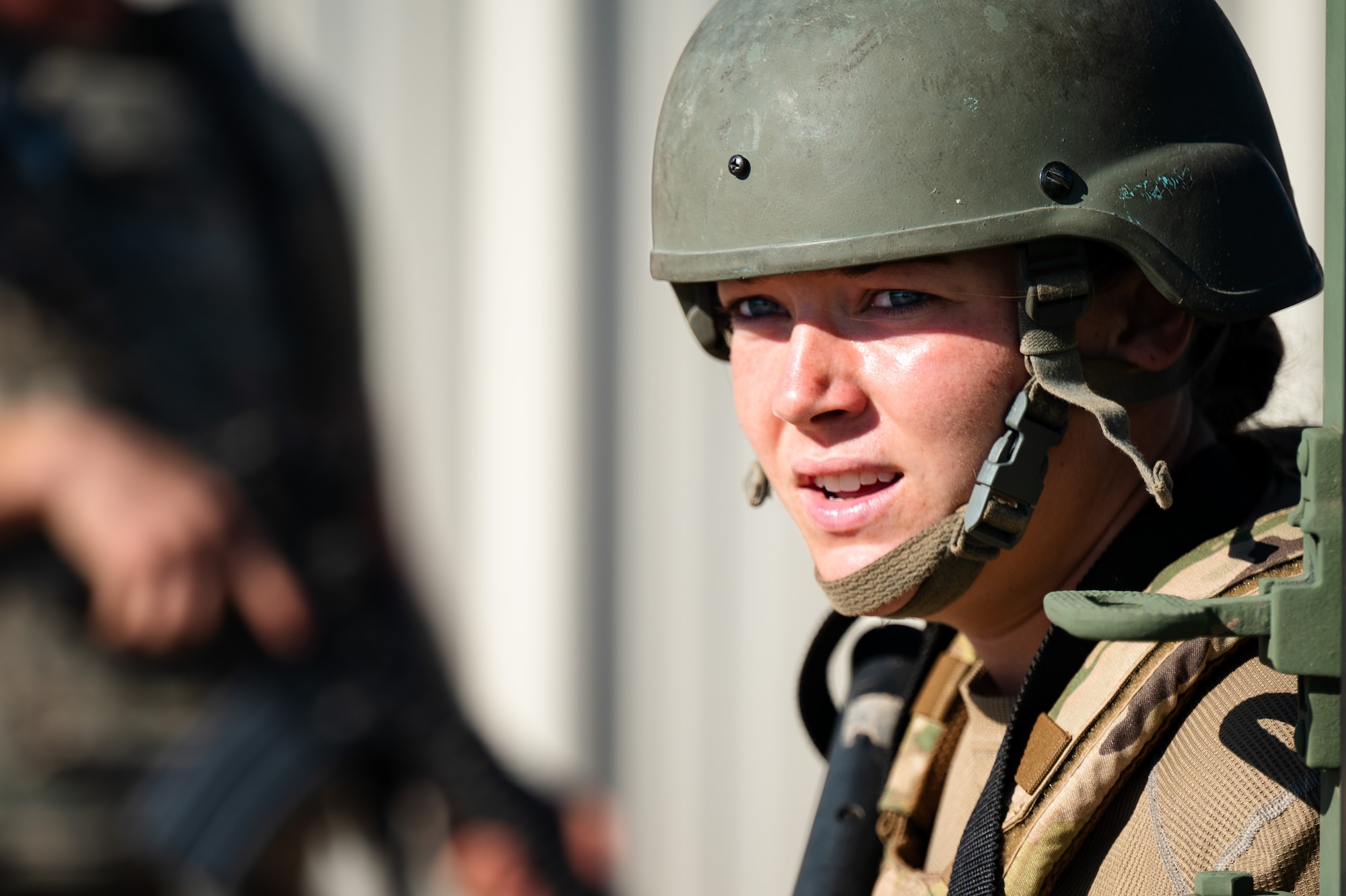 U.S. Air Force Senior Airman Sydney Galyan, 7th Civil Engineer Squadron heavy equipment operator, takes cover from opposing forces during exercise Coyote Shield at Dyess Air Force Base, Texas, Oct. 17, 2025. Through Coyote Shield, Airmen from the 7th CES and 7th Security Forces honed their skills in recovering base operations, receiving follow-on support, and re-establishing command and control, strengthening the 7th Bomb Wing's readiness in limited environments. (U.S. Air Force photo by Senior Airman Jade M. Caldwell)