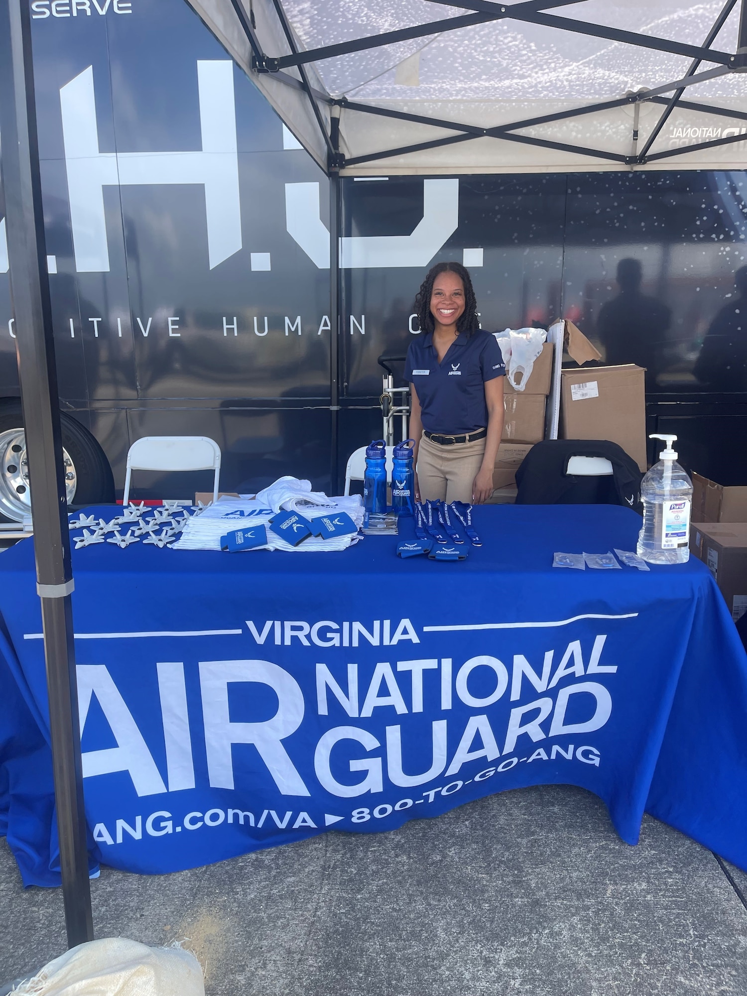 Tech. Sgt. Tatiana Forster poses for a photo at a Virginia Air National Guard recruiting booth.