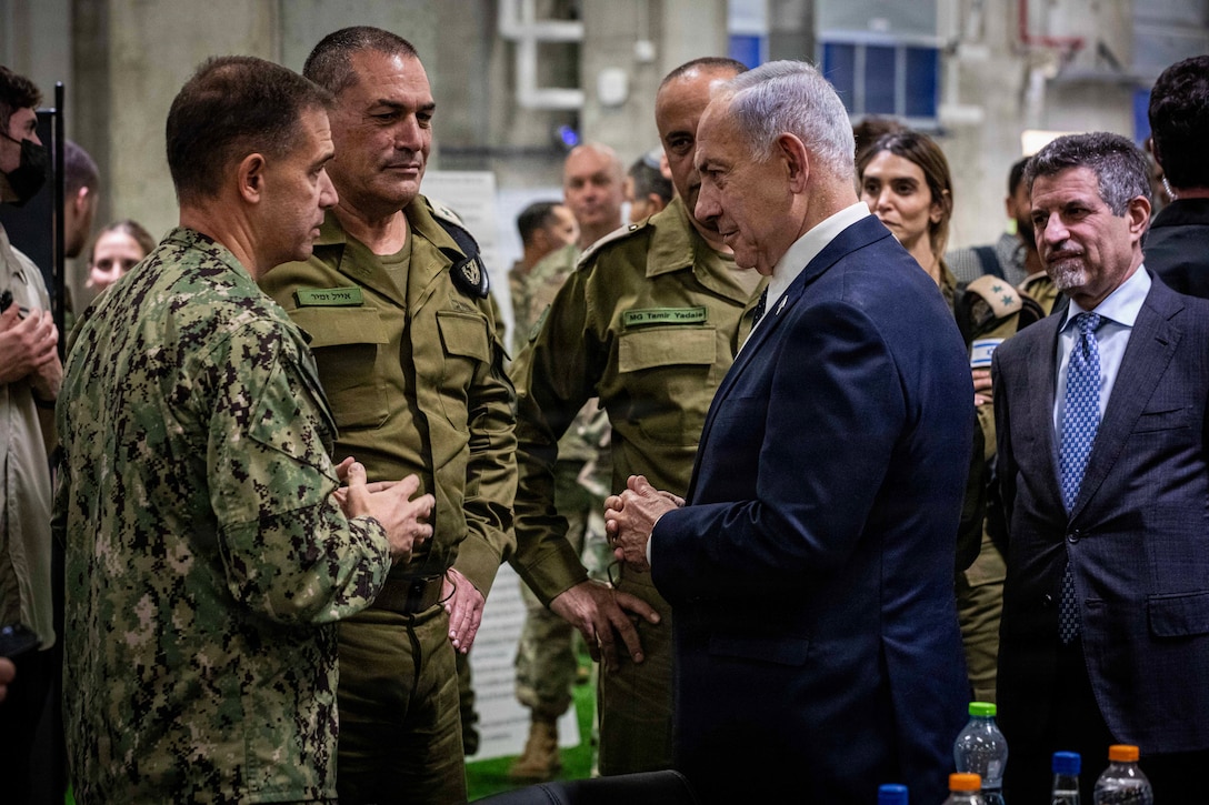 Adm. Brad Cooper, commander of U.S. Central Command, and members of the Israeli Defense Forces discuss logistics with Israeli Prime Minister Benjamin Nentanyahu inside the Civil-Military Coordination Center (CMCC) on Oct. 29, 2025, in Israel. (U.S. Army photo by Staff Sgt. Michael Ito)