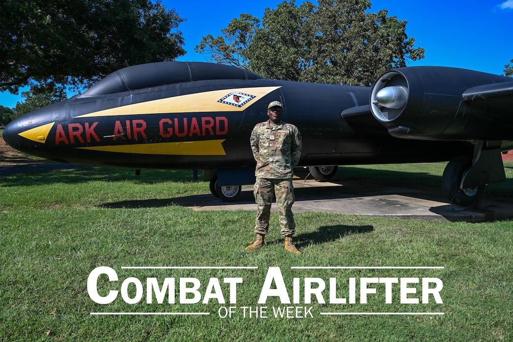 Man stands in front of plane.