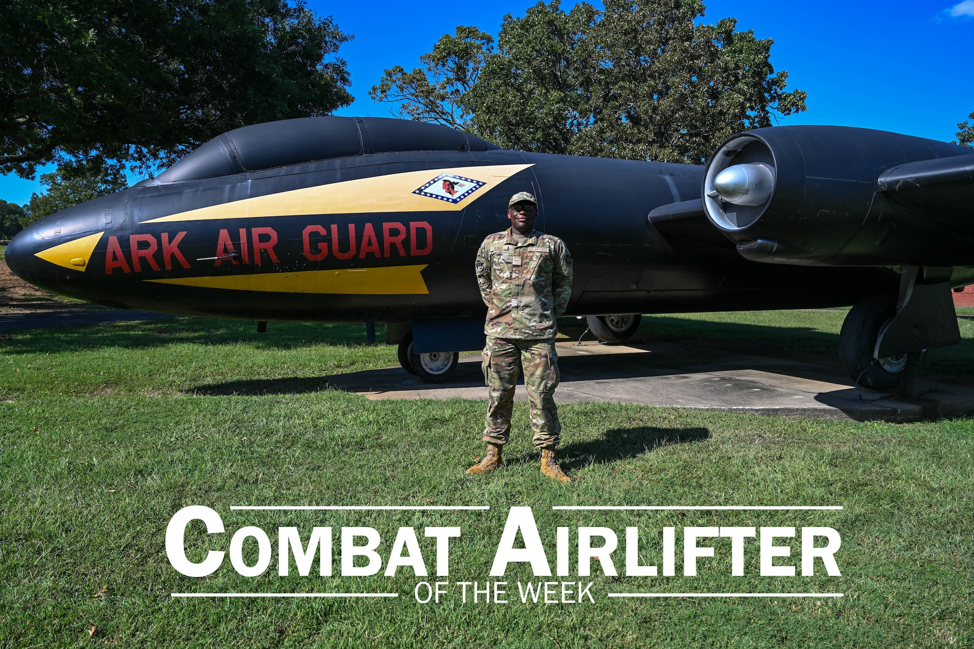 Man stands in front of plane.