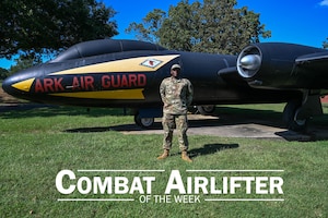 Man stands in front of plane.