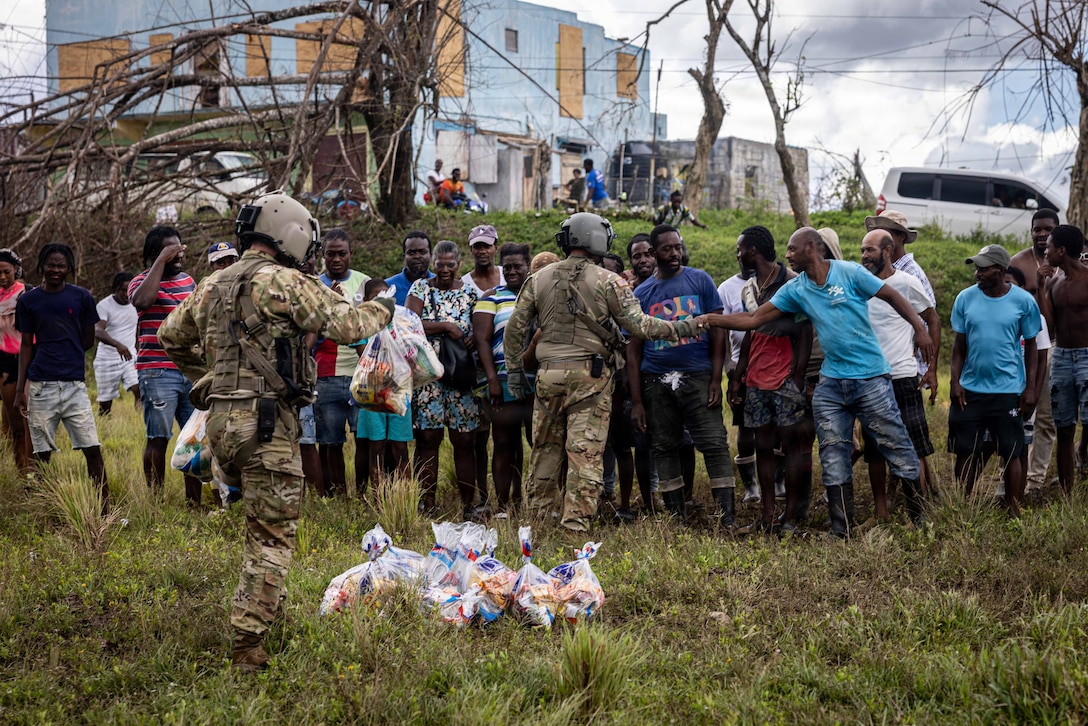 Military and civilian people greet each other